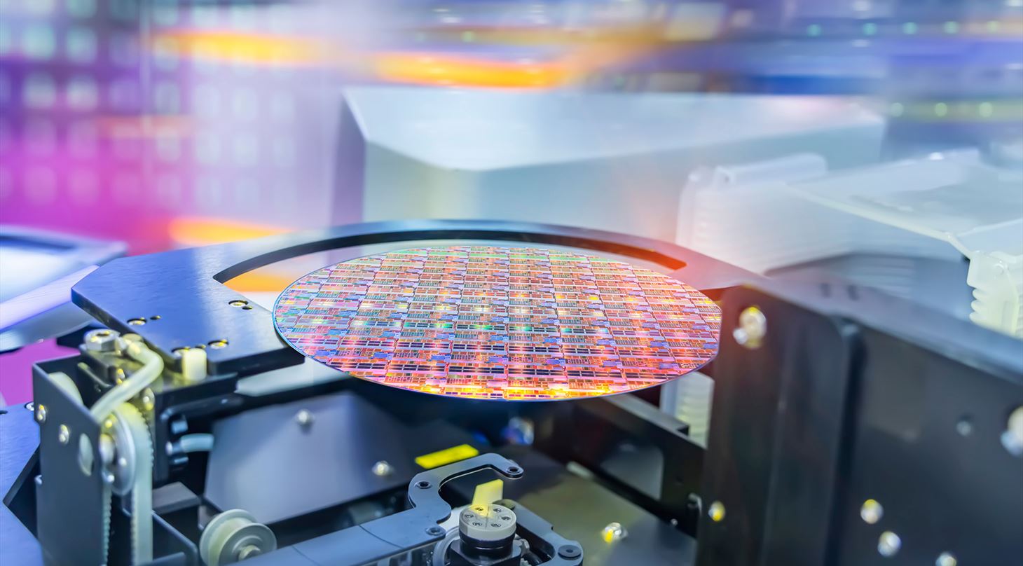 Semiconductor and Computer Chip Manufacturing at Fab or Foundry with robotic arms with silicon wafers